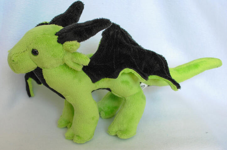 Dragon plushie made from my own pattern, featuring hand and machine sewn elements.