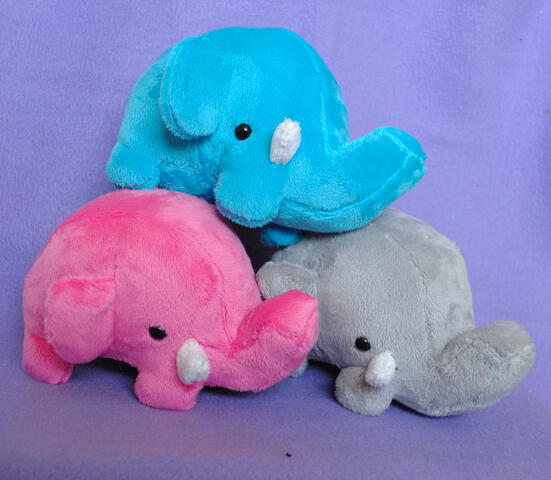 Elephant plushies made from my own pattern, featuring hand and machine sewn elements.