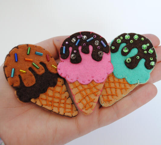Hand stitched felt ice cream hair clips with beaded sprinkles.