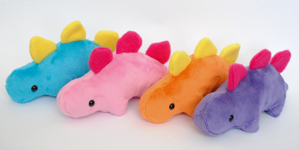 Stegosaurus plushies made with my own pattern, featuring hand and machine sewn elements.