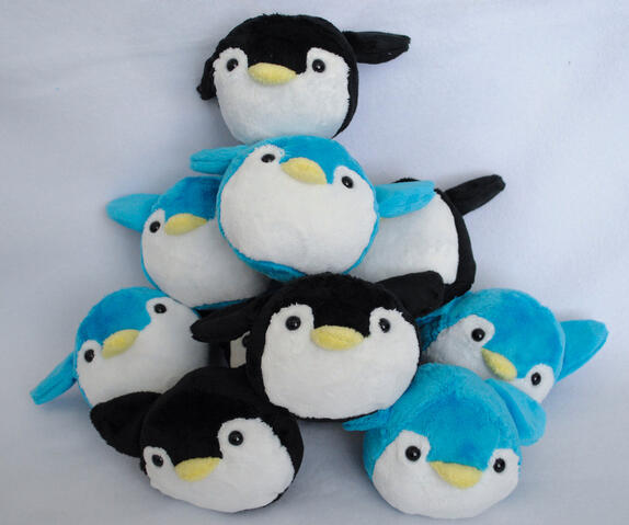 Penguin plushies made from my own pattern. Hand and machine sewn elements.