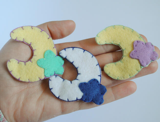 Hand stitched moon and star felt hair clips.
